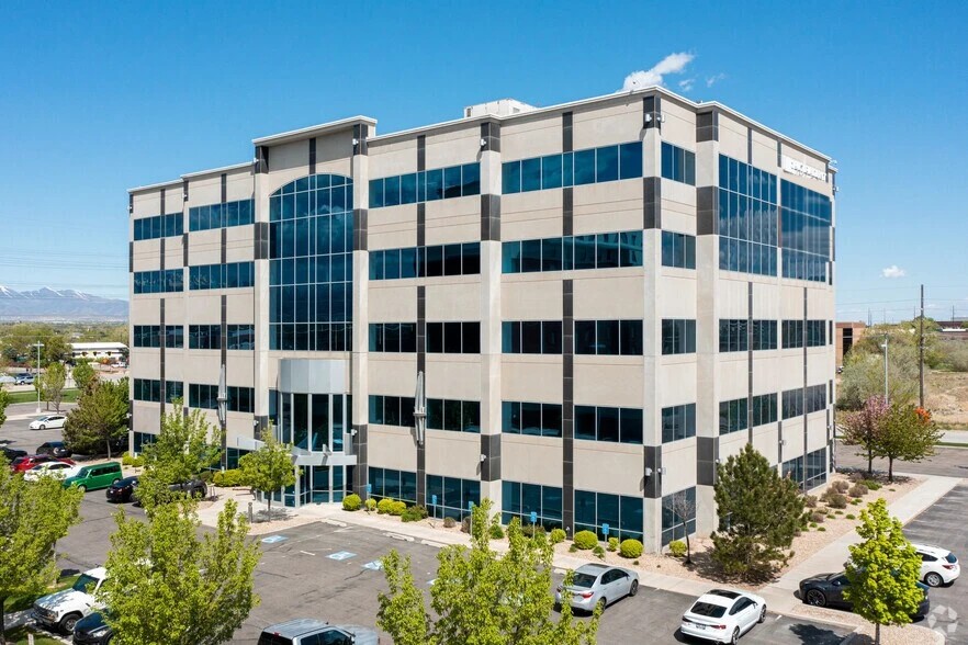The Lendio headquarters office building in Utah, a five-story building with a glass atrium entrance